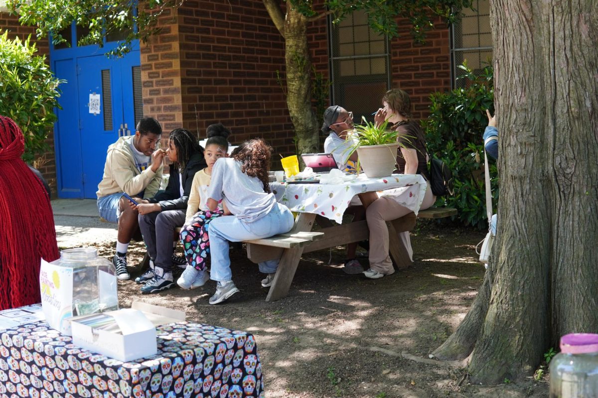A wonderful site of students face painting and showing the true colors of the Saul community.